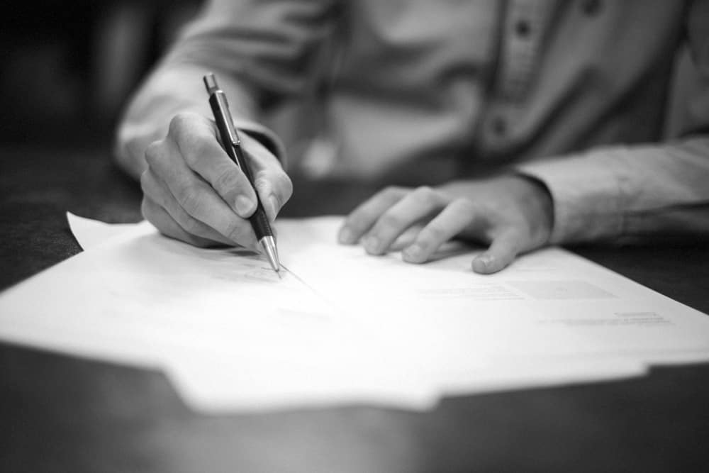 Man Signing Document — Consulting Engineers in Toowoomba, QLD (1)